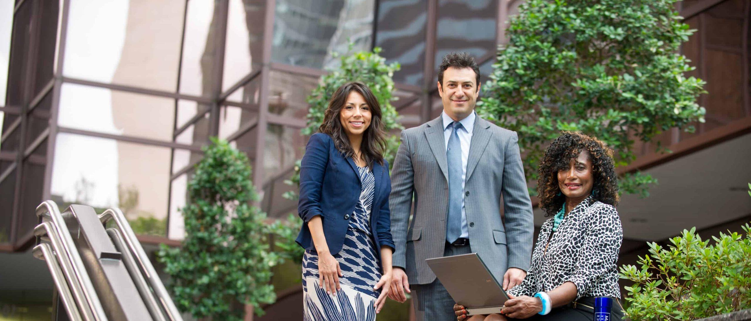 students outside a glass building